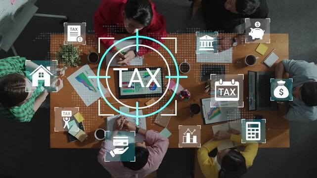 Team Collaboration at Desk with Tax Planning Strategies, Charts, and Financial Icons Illustrating the Importance of Financial Management and Planning Gluon.
