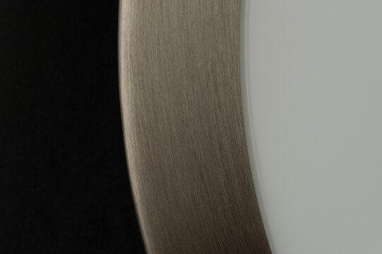 Clean brushed metal surface in plastic frame