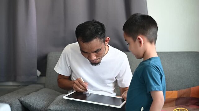 Father and son Magnetic Drawing Board makes learning and education fun for kids.