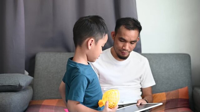 Father and son Magnetic Drawing Board helps support toddler development and learning.