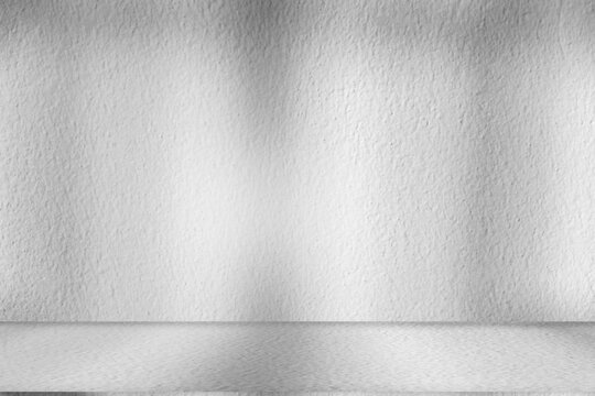 Wall interior background, studio and backdrops show products.with shadow from window color white and grey. background for text insertion and presentation product	
