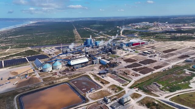 Expansive aerial view of a pulp and paper mill, showcasing the industrial facility for cellulose and bioenergy production from wood chips