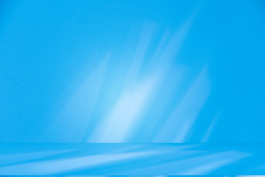 Wall interior background, studio and backdrops show products.with shadow from window color white and blue background for text insertion and presentation product	
