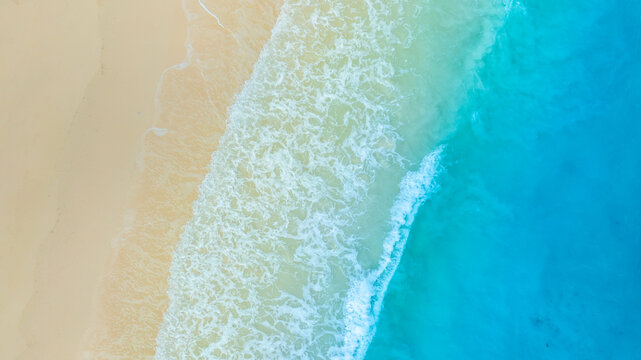 Nature of the ocean and blue sky Summer with sunshine, sandy beaches, clear blue waters sparkling against the blue sky. on an island with good ecology and environment Background for summer vacation