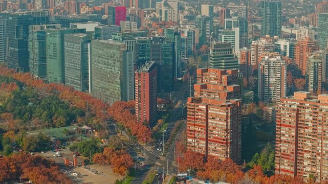 A telephoto aerial view of contrasting architectural styles modern glass buildings and other contemporary brick buildings in Las Condes, Santiago, Chile