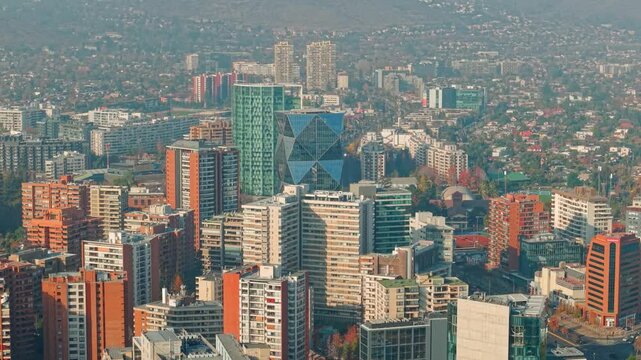 Aerial view establishing a mix of architectural styles among the residential and office buildings in Santiago, Chile, in the Las Condes neighborhood