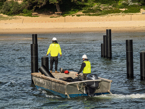 Workboat Approaching New Pier Pilings