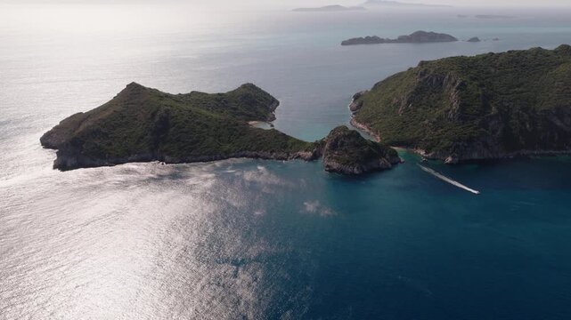 Drone reveal of Porto Timoni's twin coves in Corfu, Greece