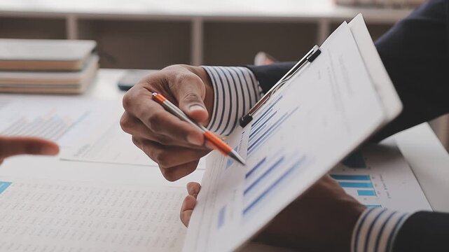 corporate, finance, budgeting, accounting, document, revenue, expenses, profit, audit, strategy, Person using calculator and reviewing financial documents for accounting and budget planning.