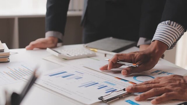 corporate, finance, budgeting, accounting, document, revenue, expenses, profit, audit, strategy, Person using calculator and reviewing financial documents for accounting and budget planning.