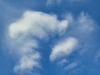 Fototapeta premium Fluffy White Cloud Shaped Like Question Mark on Clear Blue Sky Background