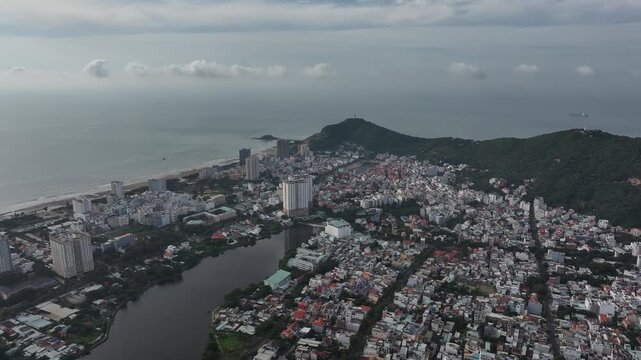 Aerial view of Vung Tau Ward, Ho Chi Minh City, Vietnam, featuring the Martyrs Monument, Bau Sen Lake and Big Mountain amid the scenic urban landscape of this coastal city.