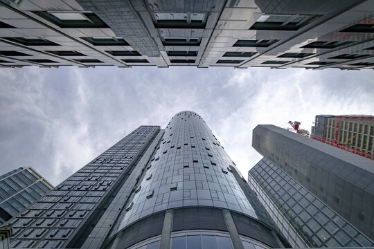 View up to the tops of skyscrapers with main tower in the middle, Frankfurt city, Germany