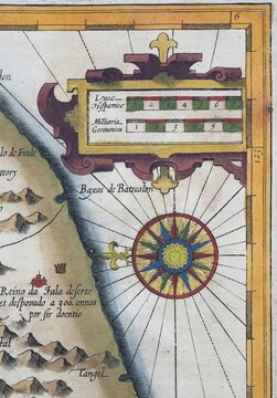 Old coloured map of Ceylon or Sri Lanka decorated with compass rose and decorative cartouche, by Jodocus Hondius from the Mercator Hondius Atlas, Amsterdam, 1633
