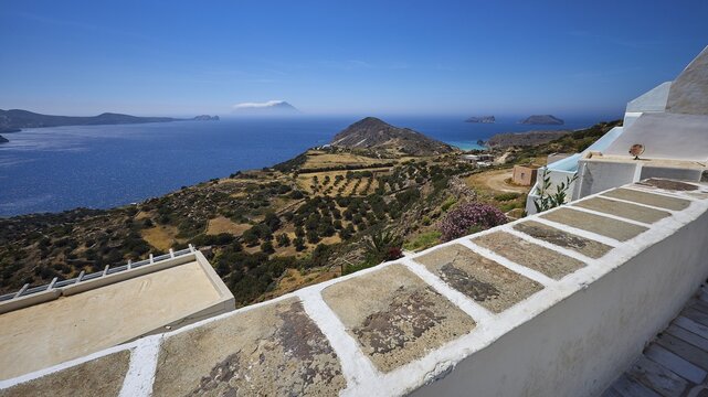 Church, Panagia Corfiatissa, view over olive groves to the coast, panorama under clear sky, Plaka, main town on Milos, island of Milos, volcanic island, Cyclades, Greek islands, Greece
