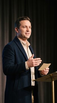 Generative AI, Businessman presenting a speech at a lectern with expressive gestures