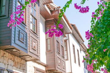 Fototapeta premium Low Angle Ottoman Houses with Bay Windows and Bougainvillea at Kaleici