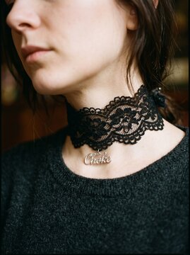 Macro photo of lace collar on woman's neck showing woman's features showing delicate skin pores natural beauty details and high-resolution skin texture with professional studio lighting
