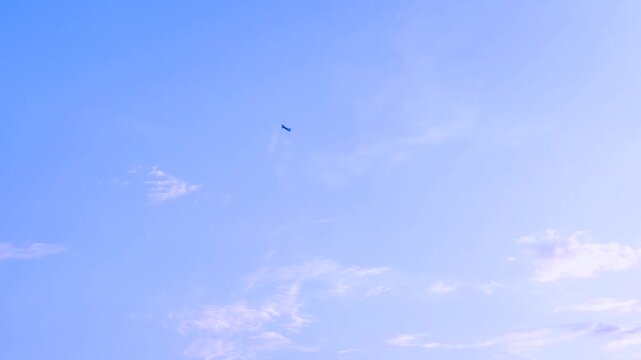 Domestic flight flying high in the city sky