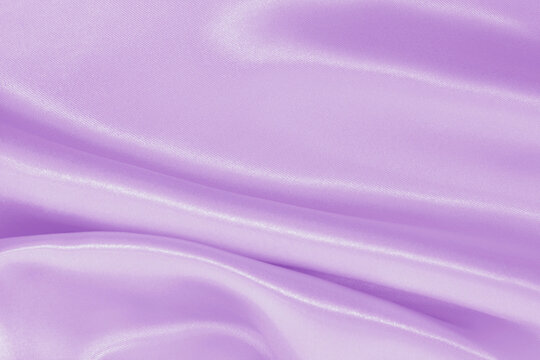 Light purple fabric texture background, detail of silk or linen pattern.