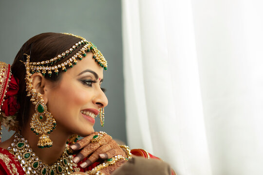 Indian bride looking out of window
