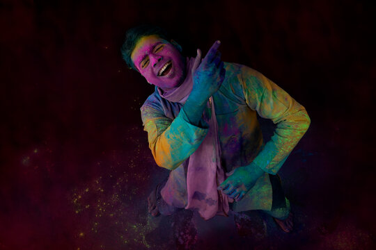 Man dancing with a dupatta in his hand to the beats of then music