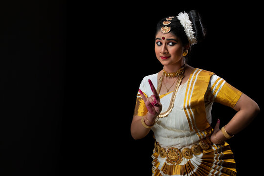 Woman representing a deer through Mrigasheersha mudra in her performance