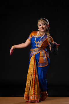 Kuchipudi dancer portraying Goddess Satyabhama wife of Lord Krishna walking on stage