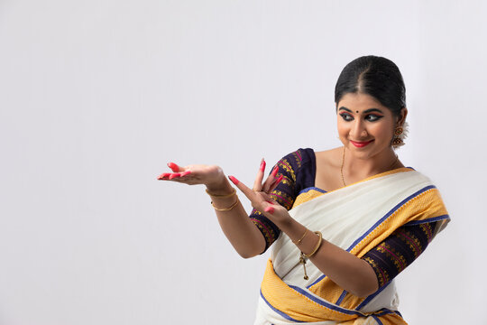 Indian classical dancer making Ardhachandra mudra 