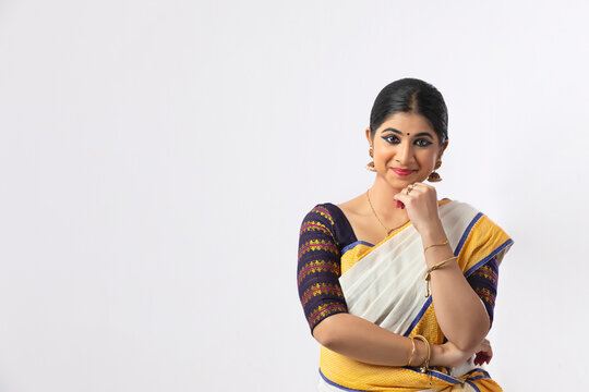 Indian classical dancer thinking about a pleasing incident and smiling
