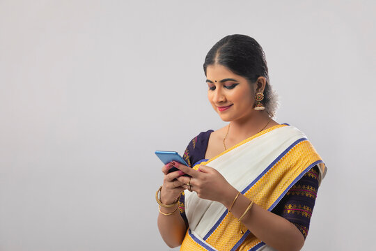 Mohiniattam dancer texting her friends on whatsapp