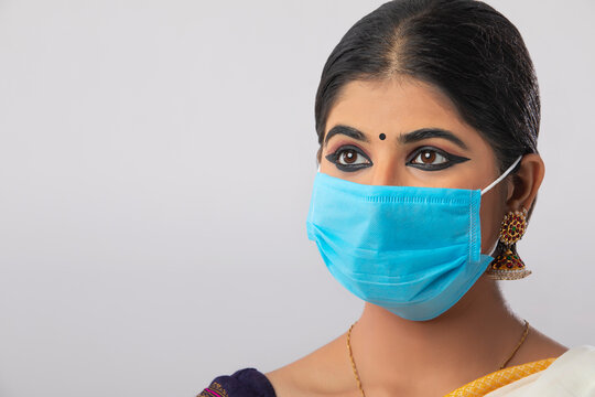 Close up of a South Indian wearing a face mask