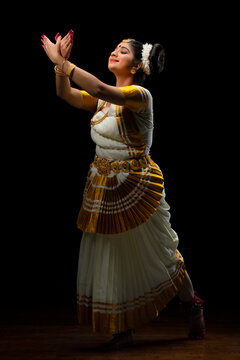 Mohiniattam dancer representing a flying bird through her dance performance
