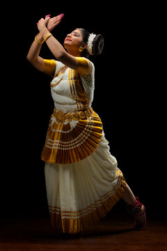 Mohiniattam dancer representing a flying bird through her dance performance