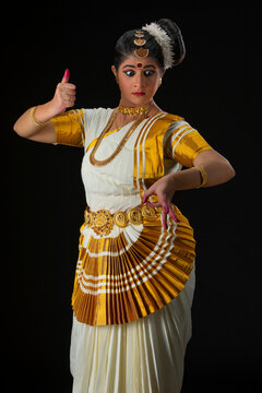 Mohiniattam dancer representing the character of Goddess Durga with a Trishul in her hand