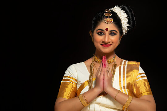 Mohiniattam dancer greeting with a smile on her face