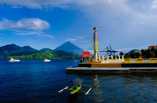 View into land of a waterfront city sign and coastal landscape, Ternate, North Maluku, Indonesia