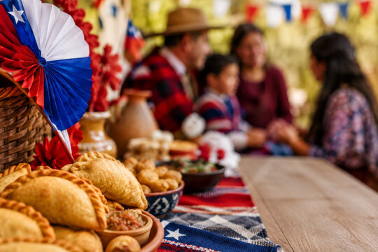 Chilean Independence Day celebration with empanadas and decor. Family gathering concept during Fiestas Patrias in Chile.
