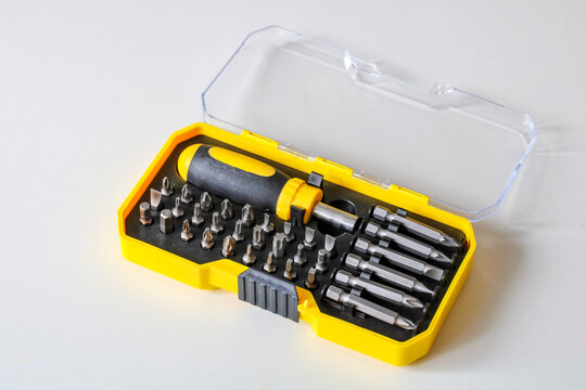 Screwdriver bit set in yellow plastic case for repair
