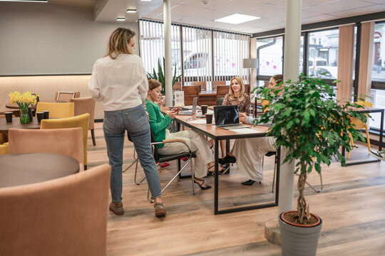 Businesswomen team meeting discussing startup ideas in modern co-working office space