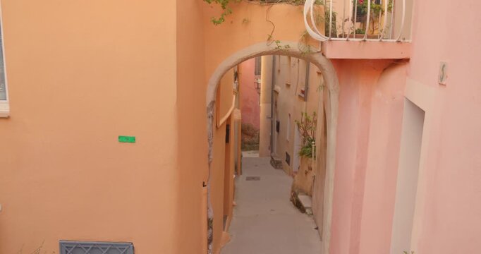 Scenic narrow alleyway and archway in the charming medieval village of Roquebrune-Cap-Martin, French Riviera. Authentic stone architecture, warm light, and traditional old-world atmosphere, perfect fo