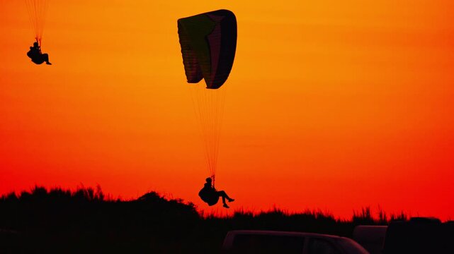 paraglider silhouette at sunset in Hanstholm, Denmark
