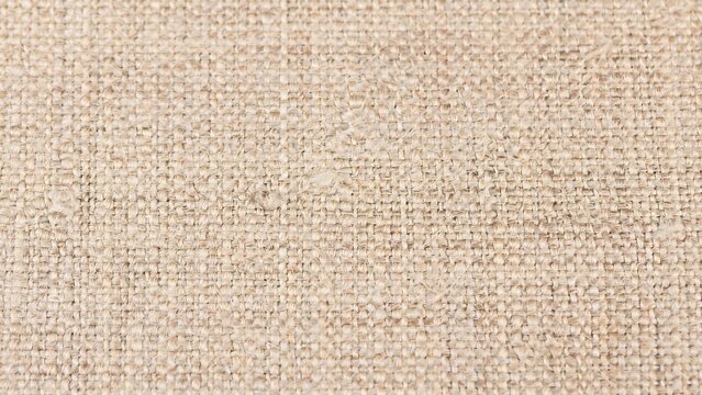 Rustic beige burlap fabric texture with visible woven sackcloth pattern for organic natural design material background.