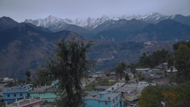 Wide Establishing Shot Of Munsyari Town Under Massive Panchachuli Peaks