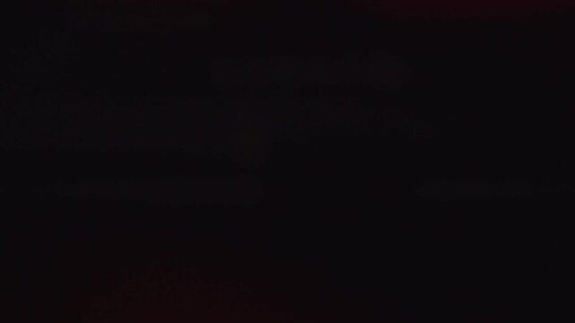 4K blurred red flashing emergency lights strobing in the dark for fire rescue or police
