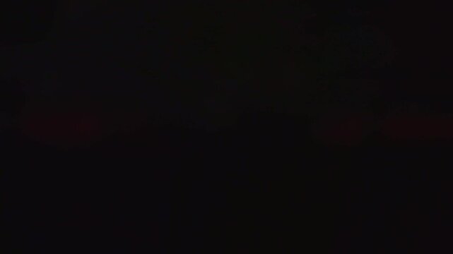 4K blurred red flashing emergency lights strobing in the dark for fire rescue or police