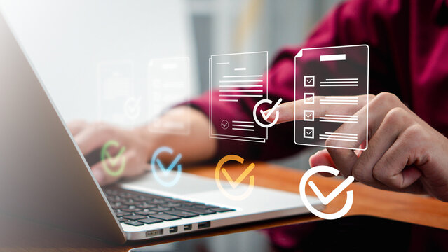 approval,efficiency,signature,policy,Business professional reviewing digital checklist documents on a laptop with electronic approval, compliance verification and document management workflow.
