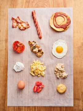 Breakfast platter with bacon, eggs, pancakes, and vegetables, ideal for brunch menu or comfort food campaigns