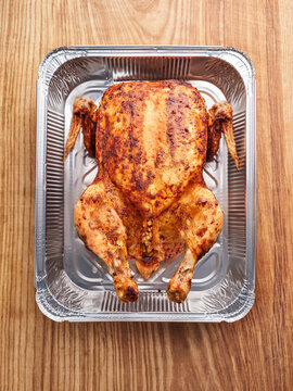 Whole roasted spiced chicken with crispy skin, perfect for family gatherings and cozy dinner parties