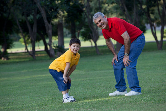 Portrait of grandfather and grandson enjoying in a park